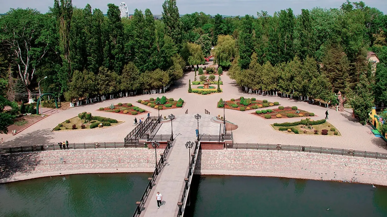 A landscaped park and waterside walkway in Cherkessk, Russia