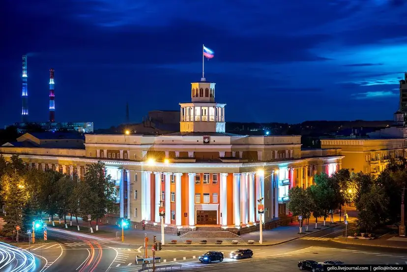 A civic building in Kemerovo, Russia, floodlit at night