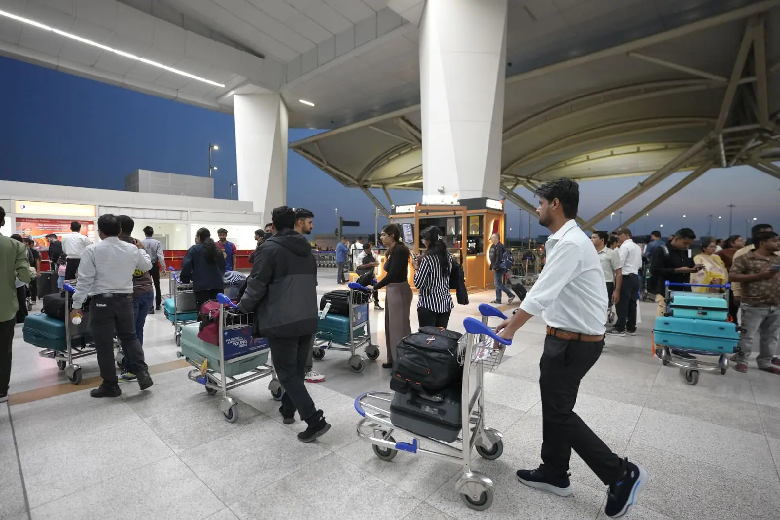 Indian students and their families at the airport before departing for medical school abroad