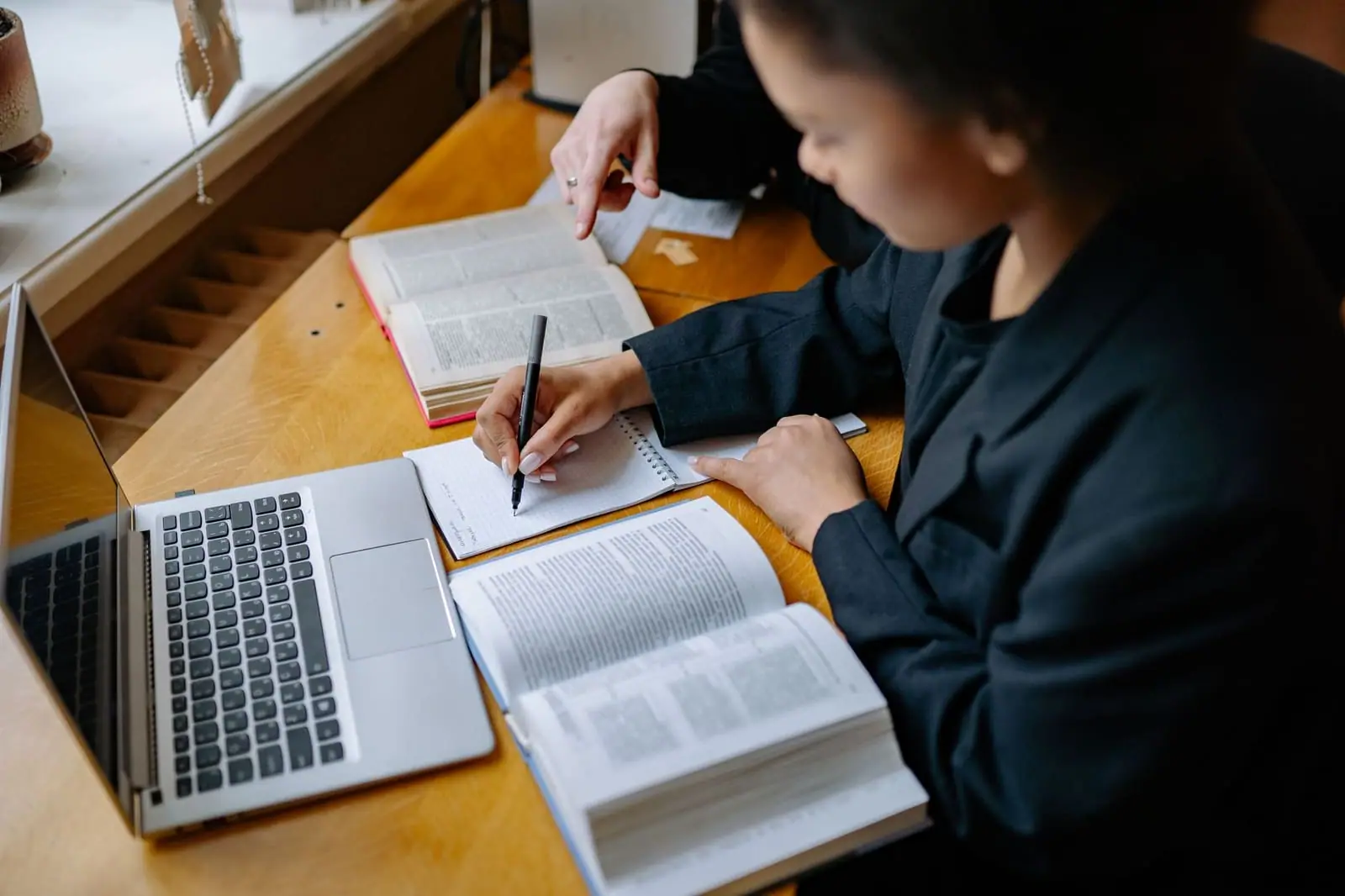 A student studying with a laptop
