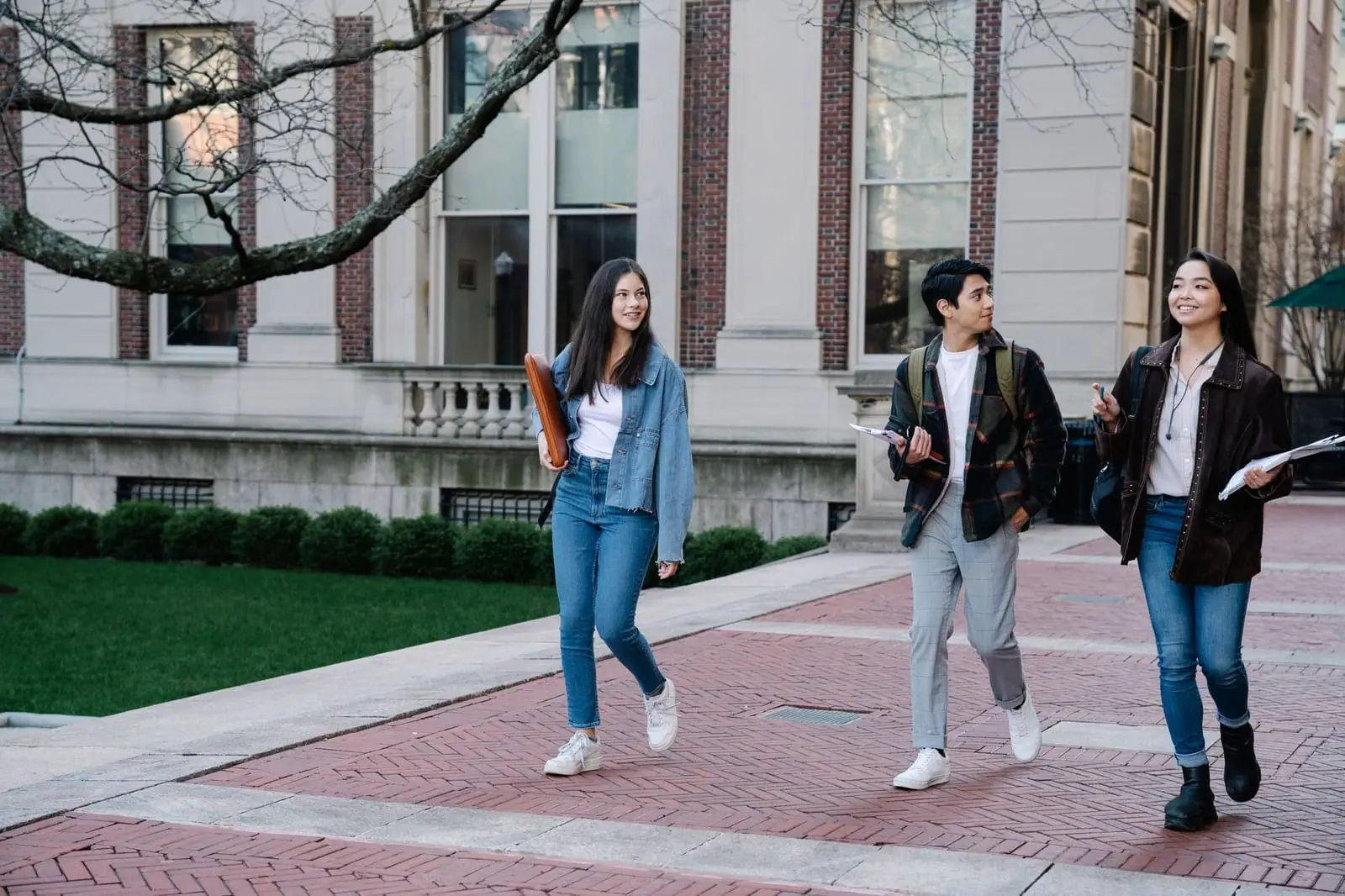 Students walking across a university campus