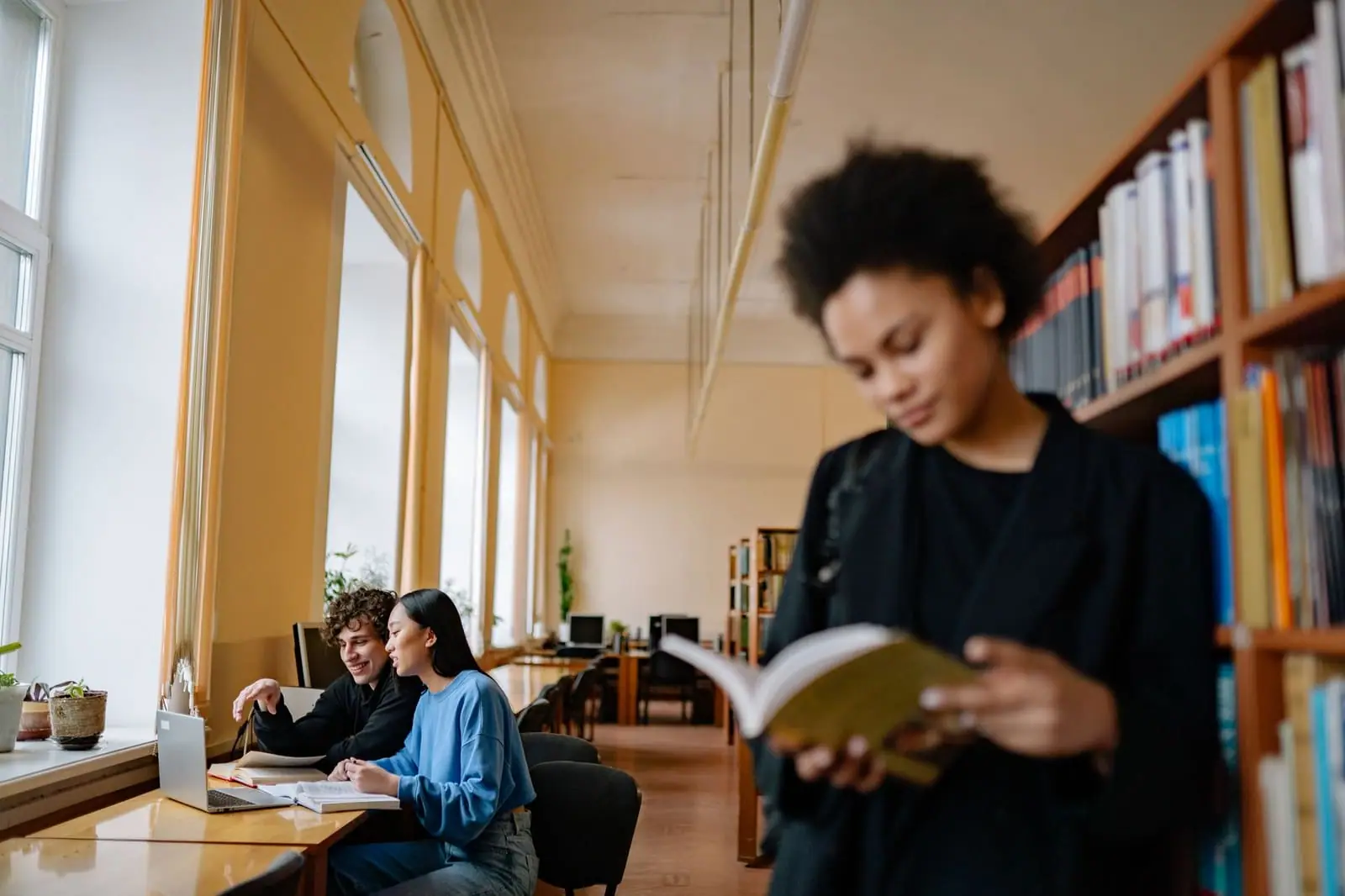 Students studying together in a library
