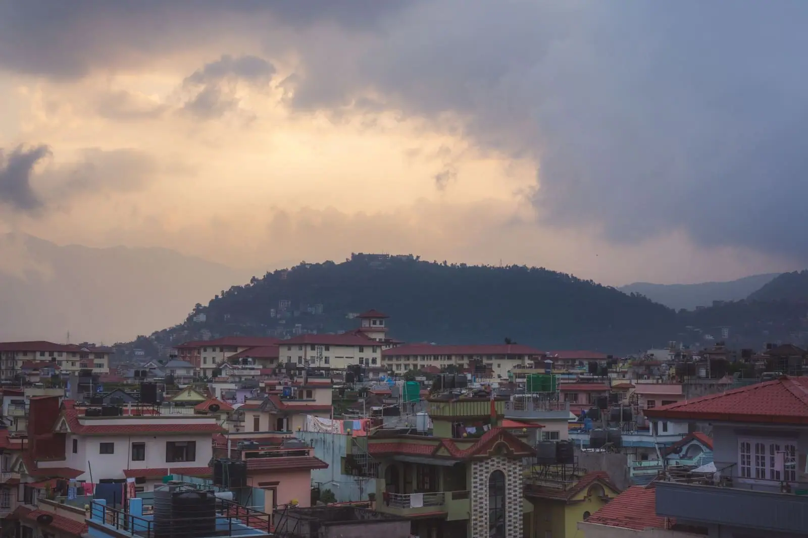 A Nepali city set against the hills